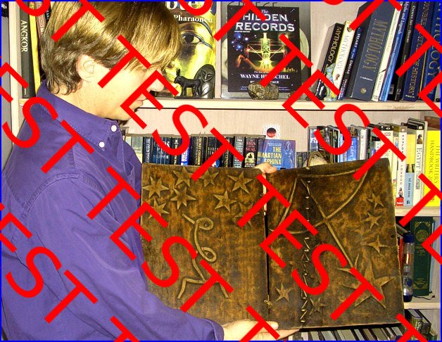 Wayne Herschel holding wooden book replica